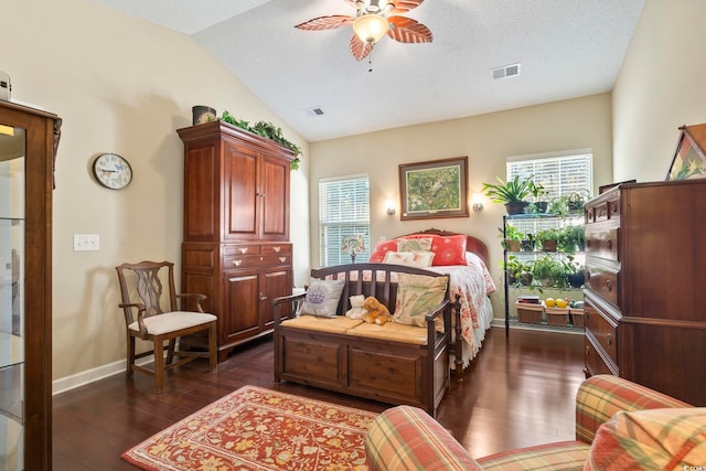 bedroom with ceiling fan, visible vents, baseboards, lofted ceiling, and dark wood finished floors