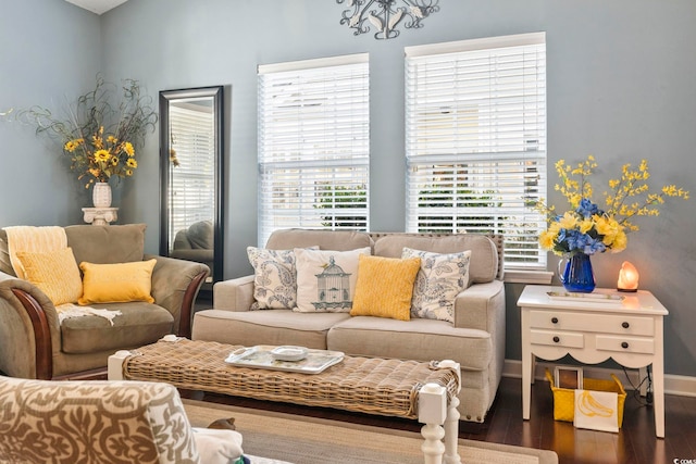 living room featuring baseboards and wood finished floors