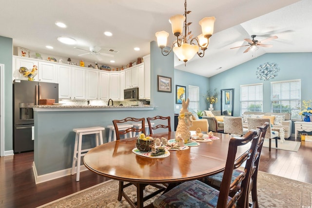 dining area with recessed lighting, dark wood-style floors, and ceiling fan with notable chandelier
