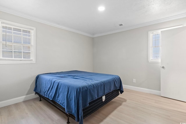 1136 Knotty Branch Rd, Conway, SC 29527 - bedroom featuring light wood finished floors, baseboards, multiple windows, ornamental molding, and recessed lighting
