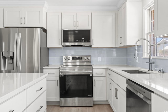 1136 Knotty Branch Rd, Conway, SC 29527 - kitchen with appliances with stainless steel finishes, a sink, white cabinetry, and light stone countertops