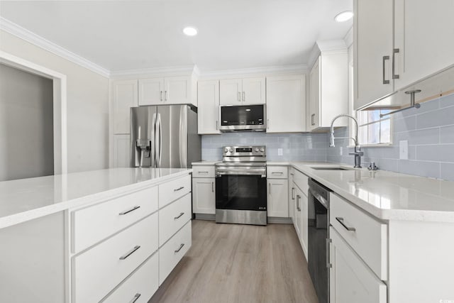 1136 Knotty Branch Rd, Conway, SC 29527 - kitchen with stainless steel appliances, a sink, white cabinets, crown molding, and recessed lighting