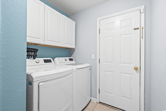 4195 Wrens Xing, Little River, SC 29566 - laundry room featuring separate washer and dryer, cabinet space, and light tile patterned floors