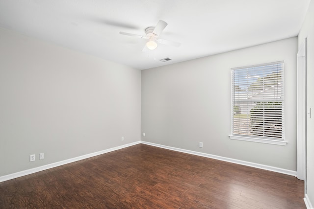 4195 Wrens Xing, Little River, SC 29566 - empty room featuring a ceiling fan, dark wood-type flooring, and baseboards