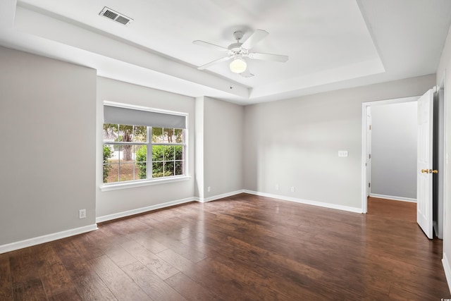 4195 Wrens Xing, Little River, SC 29566 - empty room featuring a raised ceiling, a ceiling fan, wood-type flooring, and baseboards