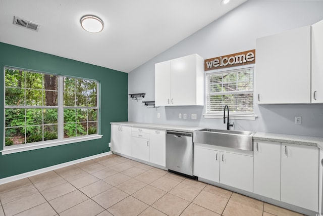4195 Wrens Xing, Little River, SC 29566 - kitchen featuring stainless steel dishwasher, a sink, vaulted ceiling, light countertops, and plenty of natural light
