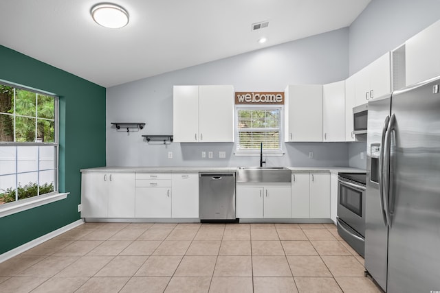 4195 Wrens Xing, Little River, SC 29566 - kitchen featuring stainless steel appliances, a sink, light countertops, healthy amount of natural light, and high vaulted ceiling