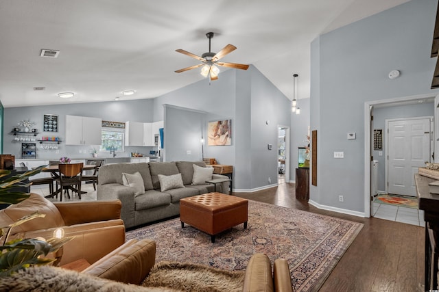 4195 Wrens Xing, Little River, SC 29566 - living room with ceiling fan, dark wood finished floors, high vaulted ceiling, and baseboards