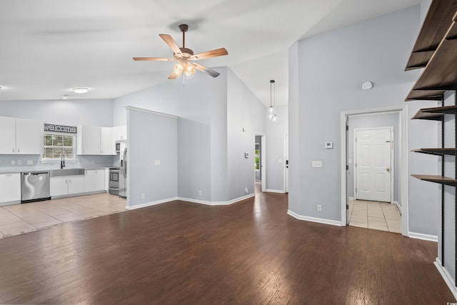4195 Wrens Xing, Little River, SC 29566 - unfurnished living room with a sink, high vaulted ceiling, ceiling fan, light wood-type flooring, and baseboards