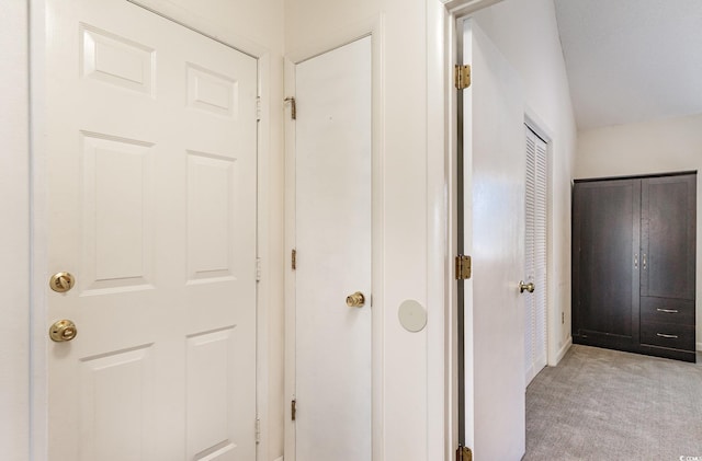 corridor with light colored carpet