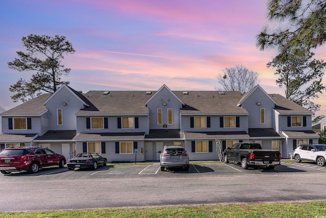 view of front facade with uncovered parking