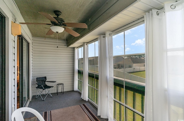 sunroom / solarium with ceiling fan
