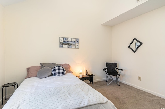 carpeted bedroom with baseboards