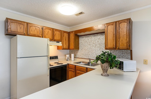 kitchen with light countertops, white appliances, under cabinet range hood, a sink, and brown cabinetry