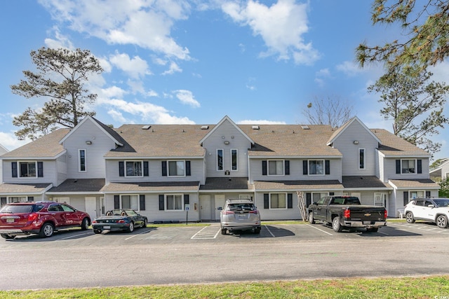 view of front of property featuring uncovered parking