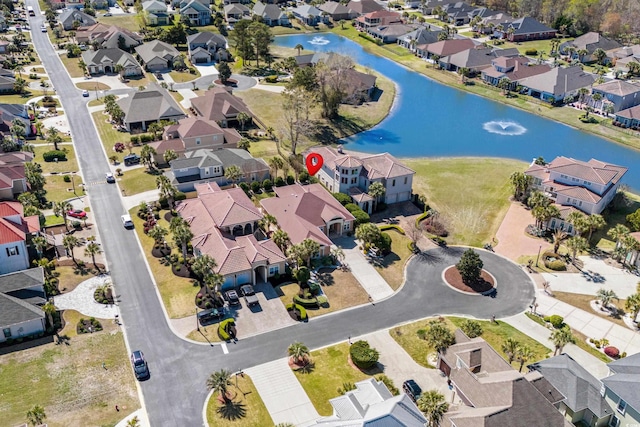 aerial view featuring a water view and a residential view