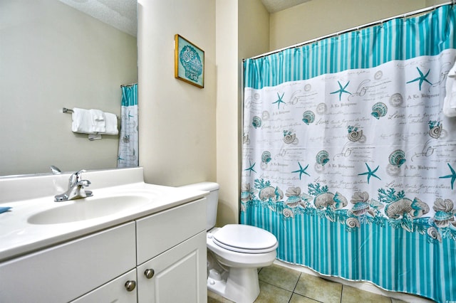 full bathroom featuring tile patterned floors, toilet, a textured ceiling, vanity, and a shower with curtain