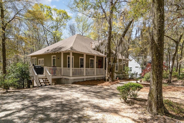 view of front of home with roof with shingles