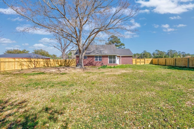 view of yard with a fenced backyard