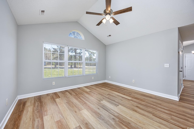 empty room with baseboards, a ceiling fan, light wood-style flooring, and visible vents