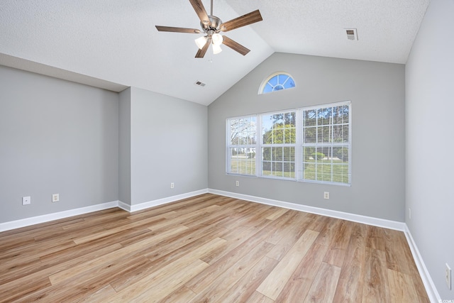 spare room featuring visible vents, baseboards, ceiling fan, and light wood-type flooring