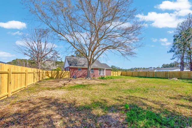view of yard with a fenced backyard