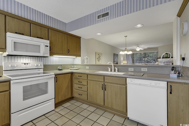 118 Hartland Dr Unit 12-C, Myrtle Beach, SC 29572 - kitchen featuring white appliances, wallpapered walls, a chandelier, light countertops, and light tile patterned floors