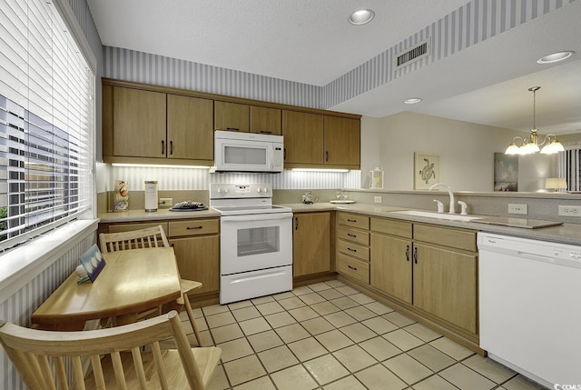 118 Hartland Dr Unit 12-C, Myrtle Beach, SC 29572 - kitchen featuring white appliances, light countertops, a chandelier, decorative light fixtures, and light tile patterned floors