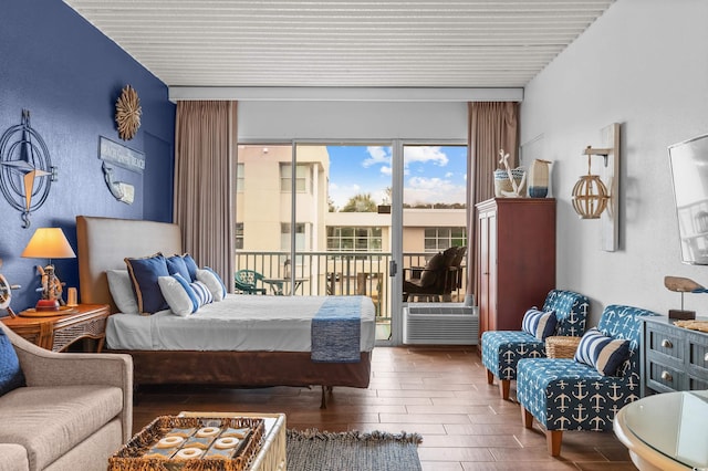 6803 N Ocean Blvd Unit 203, Myrtle Beach, SC 29572 - bedroom with access to outside, cooling unit, a textured wall, and wood finished floors