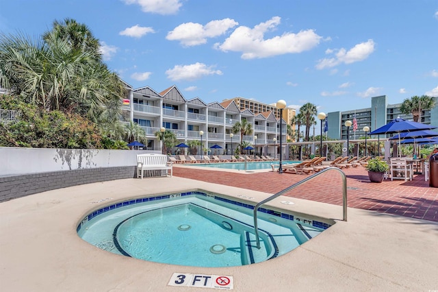 6803 N Ocean Blvd Unit 203, Myrtle Beach, SC 29572 - community pool featuring a patio and a hot tub