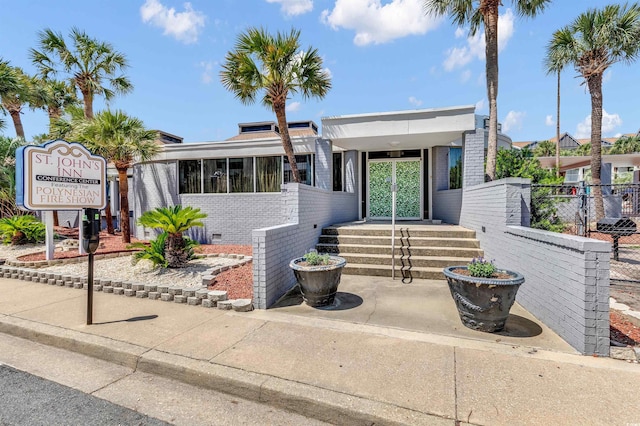 6803 N Ocean Blvd Unit 203, Myrtle Beach, SC 29572 - view of front of property with fence and brick siding