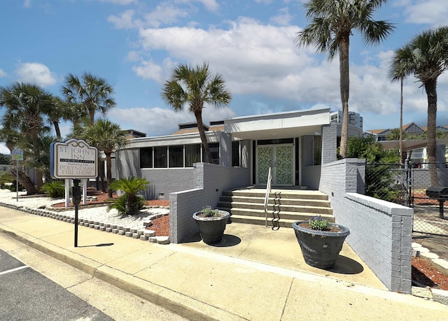 6803 N Ocean Blvd Unit 203, Myrtle Beach, SC 29572 - view of front facade featuring fence and brick siding