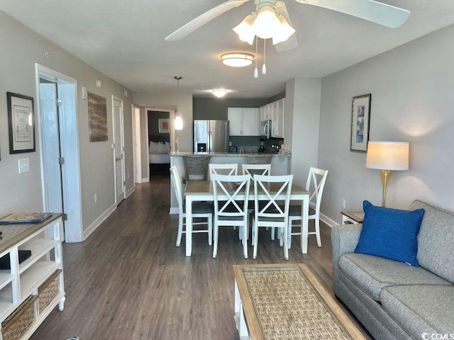 3500 N Ocean Blvd Unit 1203, North Myrtle Beach, SC 29582 - dining space featuring a ceiling fan and dark wood-style flooring