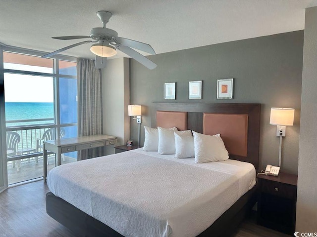 3500 N Ocean Blvd Unit 1203, North Myrtle Beach, SC 29582 - bedroom featuring a wall of windows, access to outside, wood finished floors, and ceiling fan