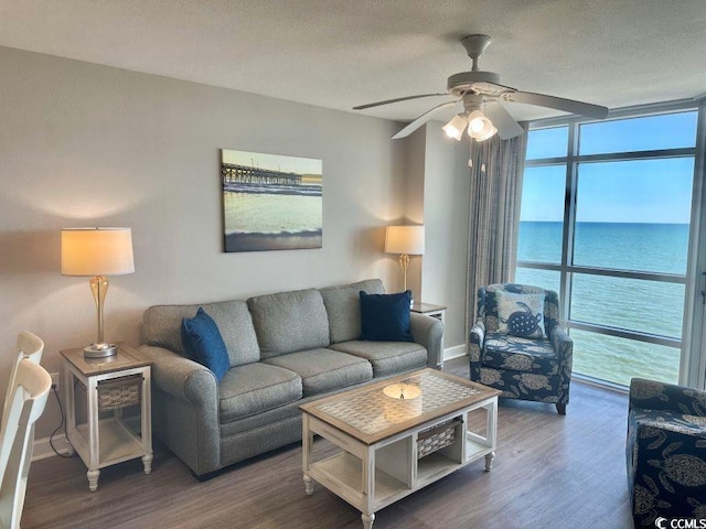 3500 N Ocean Blvd Unit 1203, North Myrtle Beach, SC 29582 - living room with floor to ceiling windows, ceiling fan, wood finished floors, and a water view
