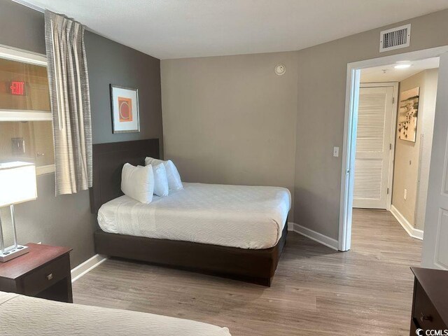 3500 N Ocean Blvd Unit 1203, North Myrtle Beach, SC 29582 - bedroom with wood finished floors and baseboards