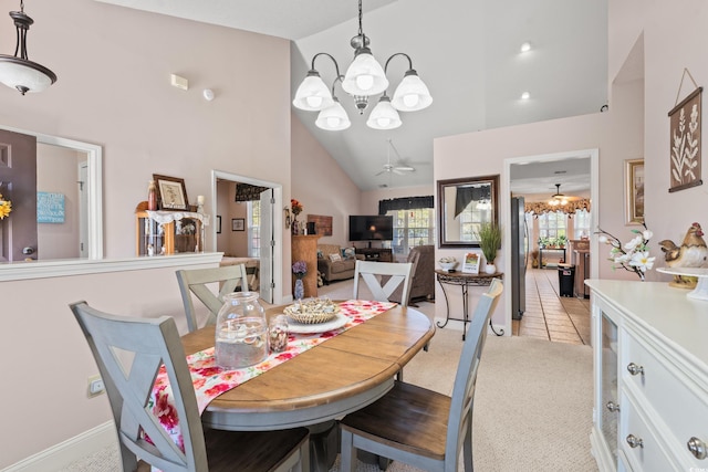 542 Sand Ridge Rd, Conway, SC 29526 - dining room featuring a chandelier, high vaulted ceiling, light colored carpet, light tile patterned floors, and a ceiling fan