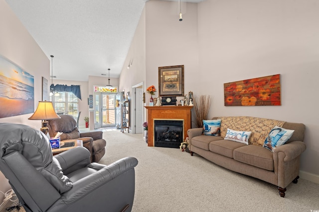 542 Sand Ridge Rd, Conway, SC 29526 - living room featuring carpet floors, a towering ceiling, and a fireplace