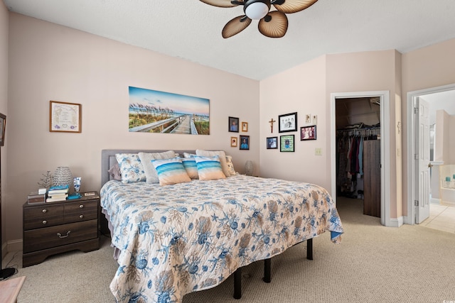 542 Sand Ridge Rd, Conway, SC 29526 - carpeted bedroom with a walk in closet, a closet, baseboards, a ceiling fan, and ensuite bath