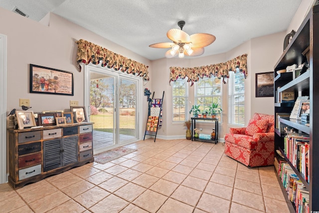 542 Sand Ridge Rd, Conway, SC 29526 - living area with a textured ceiling, ceiling fan, light tile patterned flooring, and baseboards