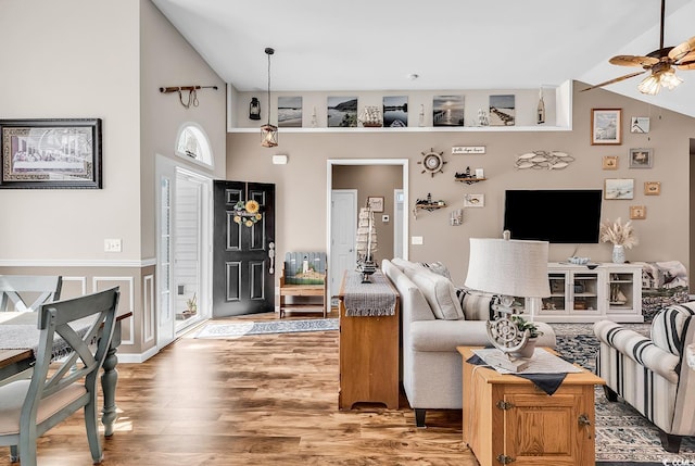 508 Loblolly Ln, Loris, SC 29569 - living area with wood finished floors, lofted ceiling, ceiling fan, and a wainscoted wall