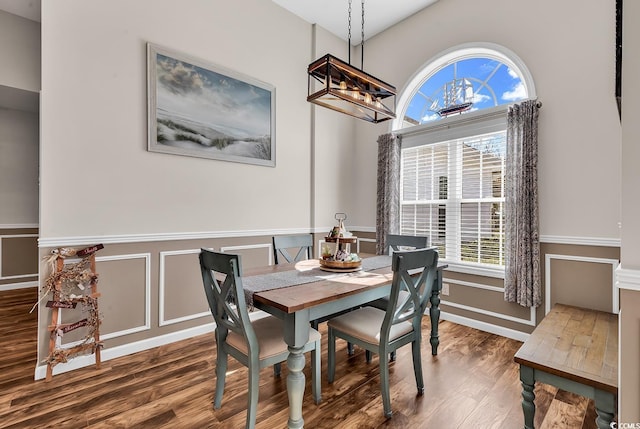 508 Loblolly Ln, Loris, SC 29569 - dining space with wood finished floors, a wainscoted wall, a chandelier, and a decorative wall