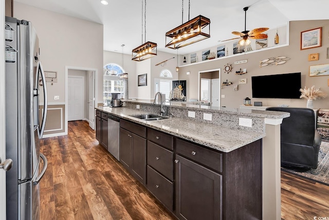 508 Loblolly Ln, Loris, SC 29569 - kitchen featuring stainless steel appliances, a sink, open floor plan, a ceiling fan, and dark wood finished floors