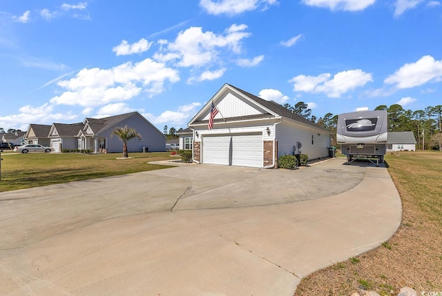 508 Loblolly Ln, Loris, SC 29569 - view of front of home featuring a front yard, brick siding, driveway, and a garage