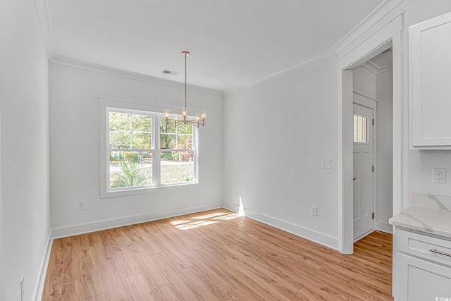 unfurnished dining area featuring baseboards, a chandelier, crown molding, light wood-style floors, and visible vents