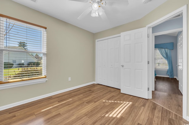 308 Dendy Ct, Myrtle Beach, SC 29579 - unfurnished bedroom with baseboards, wood finished floors, a closet, and ceiling fan