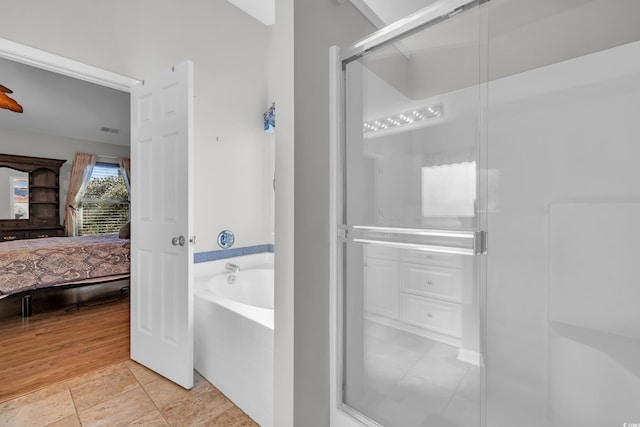 308 Dendy Ct, Myrtle Beach, SC 29579 - ensuite bathroom featuring a bath and a shower stall