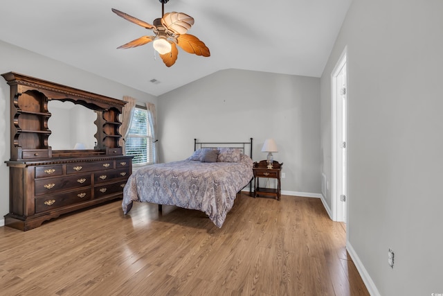 308 Dendy Ct, Myrtle Beach, SC 29579 - bedroom with vaulted ceiling, light wood-style flooring, a ceiling fan, and baseboards