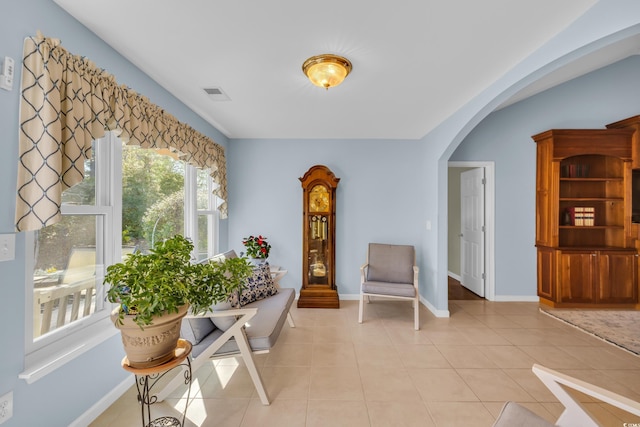308 Dendy Ct, Myrtle Beach, SC 29579 - living area featuring arched walkways, light tile patterned floors, and baseboards