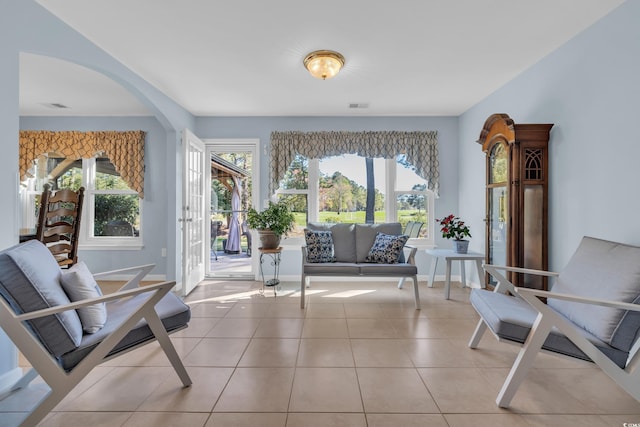 308 Dendy Ct, Myrtle Beach, SC 29579 - living area with plenty of natural light, arched walkways, and light tile patterned floors